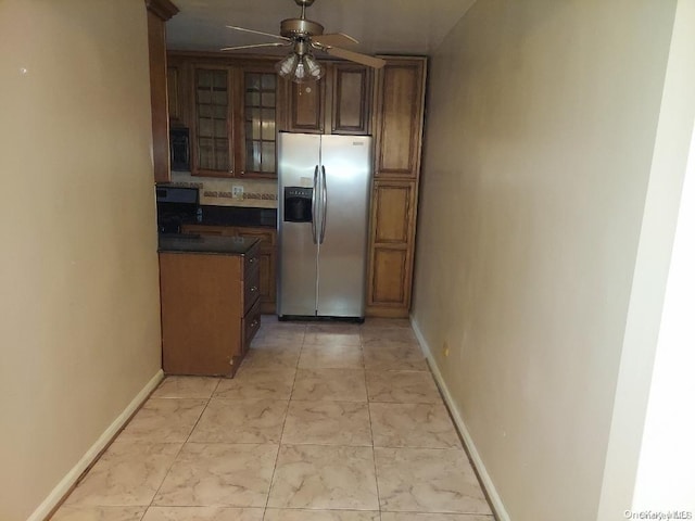 kitchen with stainless steel fridge with ice dispenser and ceiling fan