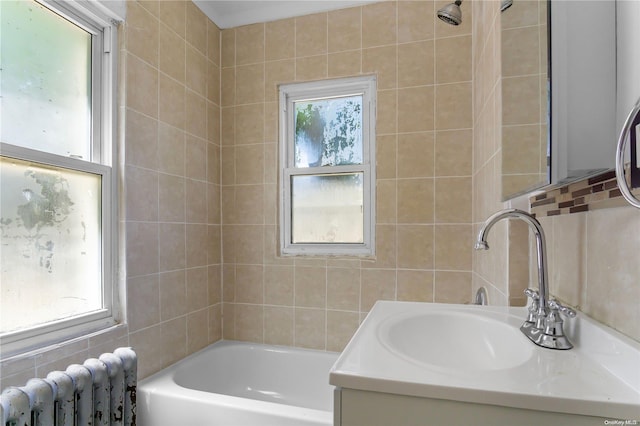 bathroom featuring vanity, tile walls, and radiator