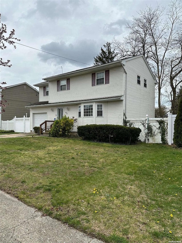 front facade featuring a front lawn and a garage