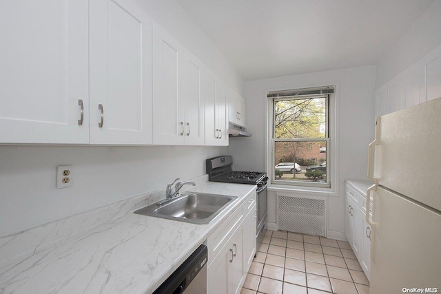 kitchen featuring light stone countertops, stainless steel appliances, sink, light tile patterned floors, and white cabinets