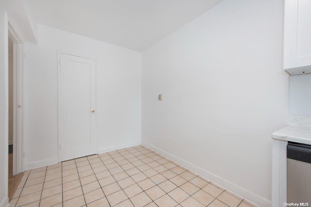 spare room with light tile patterned floors