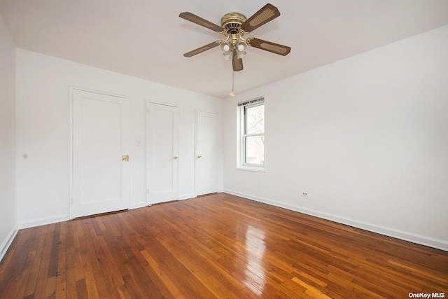 unfurnished bedroom with hardwood / wood-style flooring and ceiling fan