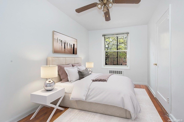 bedroom featuring hardwood / wood-style flooring and ceiling fan