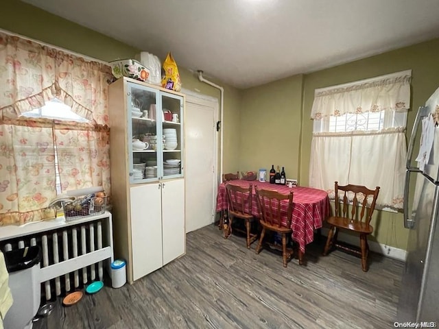 dining room with wood-type flooring