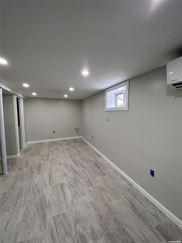 basement with a wall mounted AC