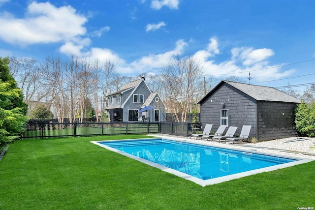 view of swimming pool with a lawn