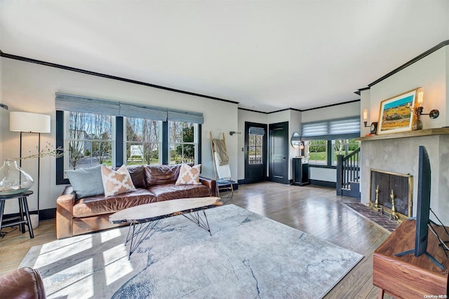 living room featuring hardwood / wood-style flooring and crown molding