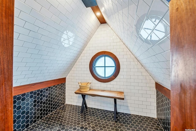 bathroom with lofted ceiling