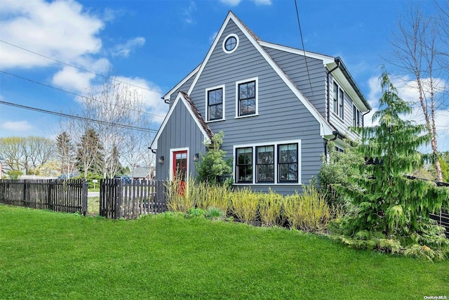 back of house featuring a yard