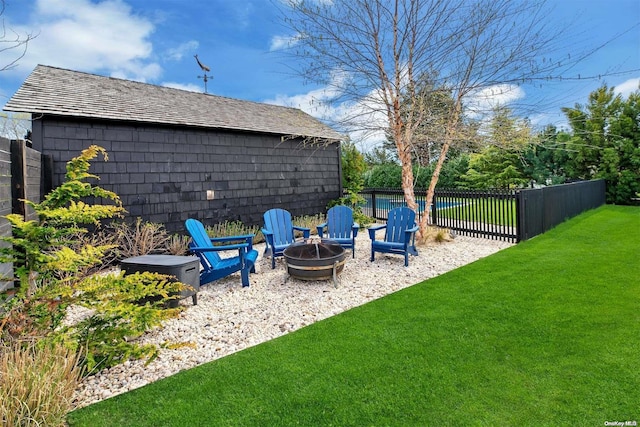 view of yard with an outdoor fire pit