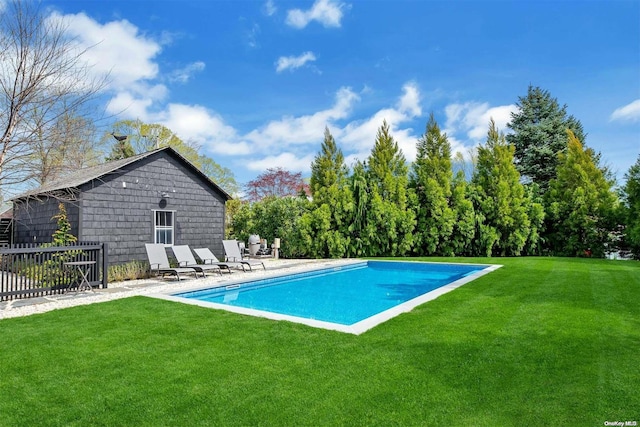 view of swimming pool with a lawn and a patio