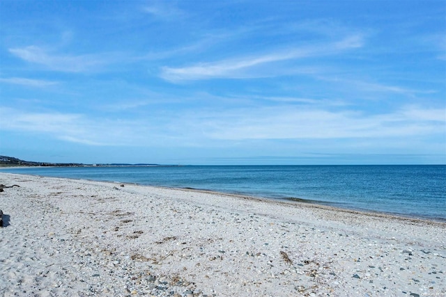 view of water feature with a beach view