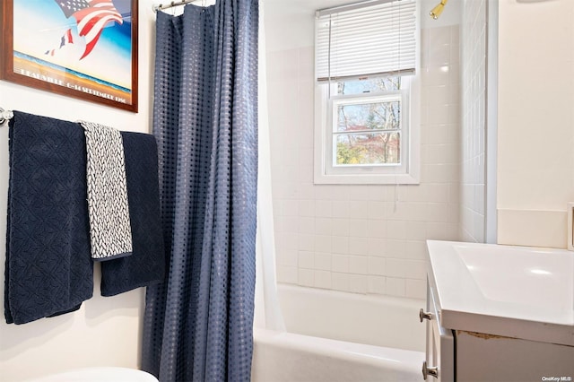 full bathroom with vanity, toilet, and shower / tub combo