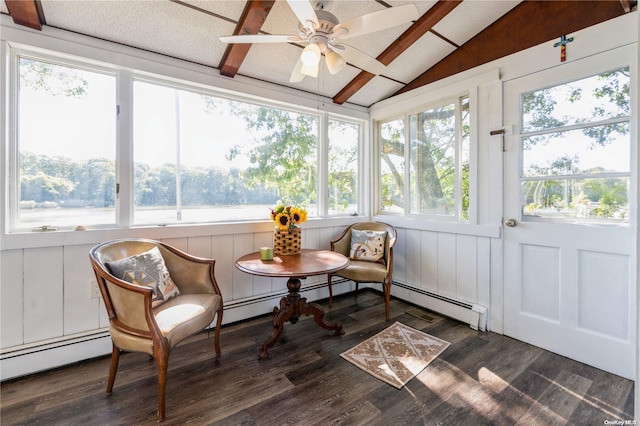 sunroom / solarium featuring ceiling fan, a baseboard heating unit, and vaulted ceiling