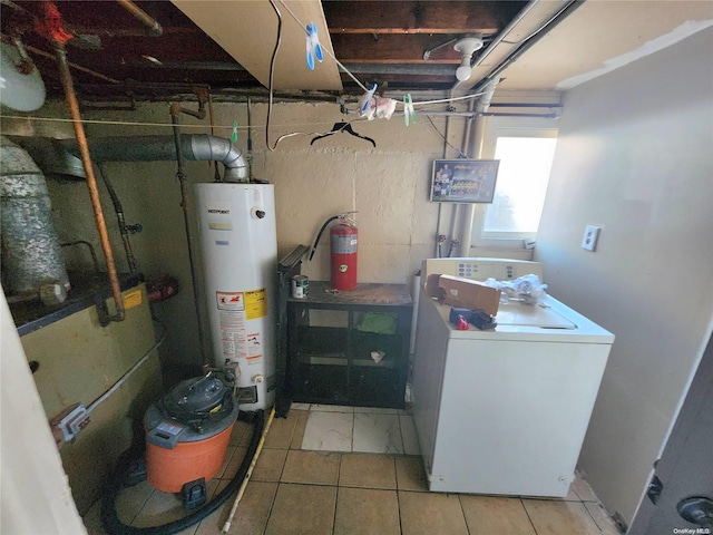 utilities featuring gas water heater and washer / clothes dryer