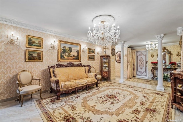 sitting room featuring decorative columns, crown molding, and a notable chandelier