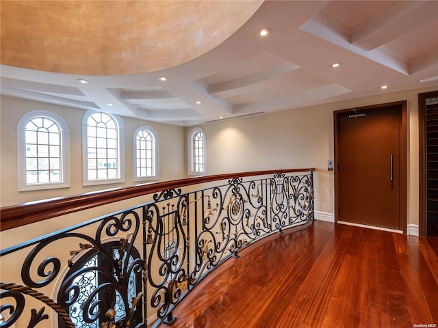 hall featuring hardwood / wood-style flooring and beamed ceiling