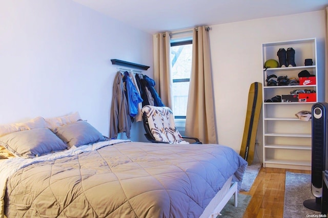 bedroom with hardwood / wood-style flooring