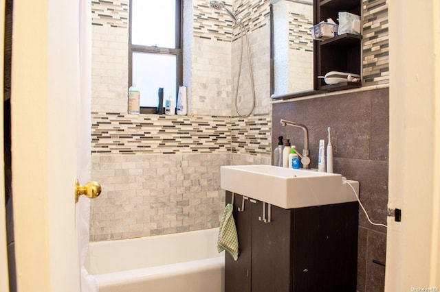 bathroom featuring shower / bath combo and vanity