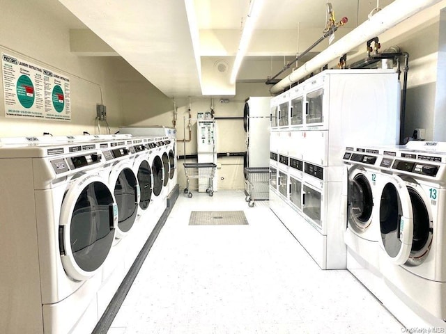 washroom featuring separate washer and dryer and stacked washer / drying machine