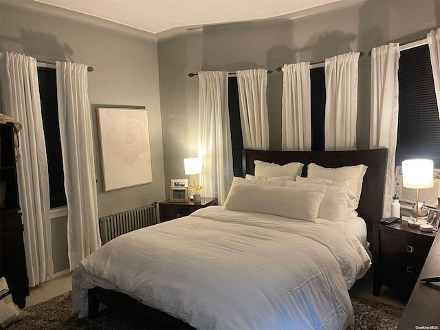 bedroom with carpet and radiator