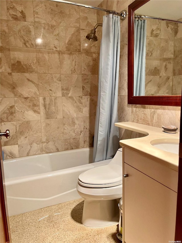 full bathroom featuring shower / bath combination with curtain, vanity, and toilet