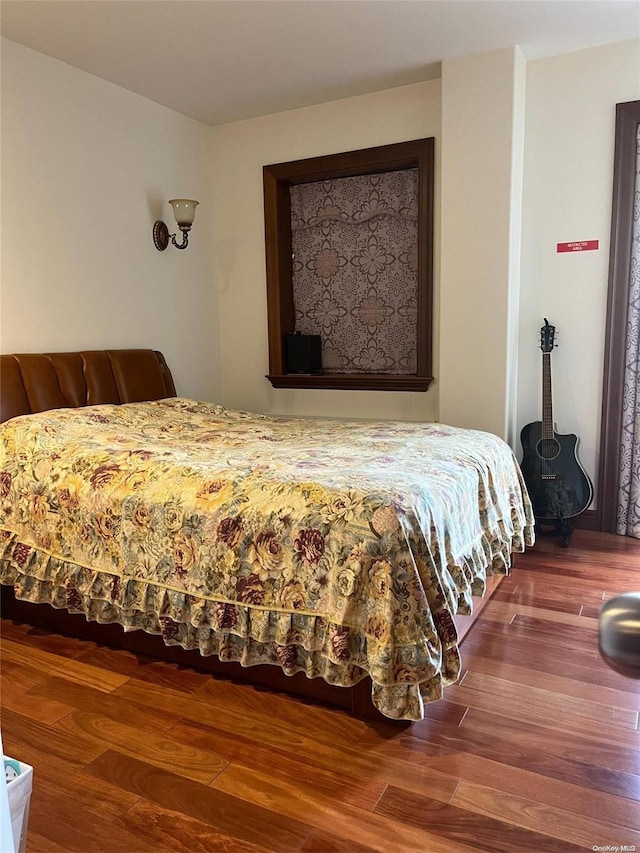 bedroom featuring hardwood / wood-style floors