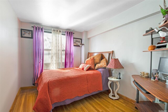 bedroom featuring light wood-type flooring