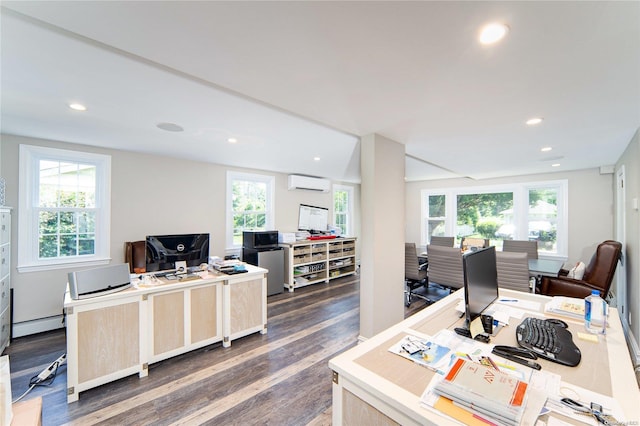 home office with a wall unit AC, a wealth of natural light, and dark wood-type flooring