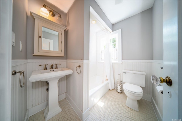 full bathroom featuring tile patterned floors, sink, toilet, and tub / shower combination