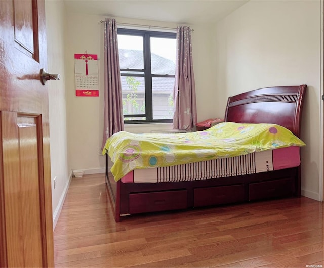 bedroom featuring hardwood / wood-style floors