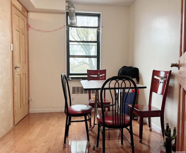 dining area featuring light wood-type flooring