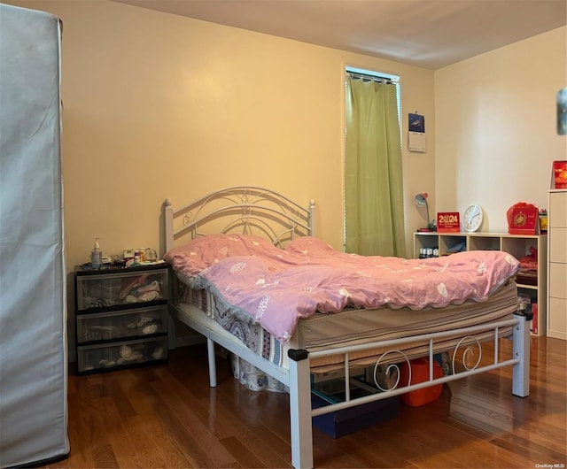 bedroom featuring dark hardwood / wood-style floors