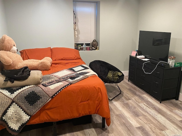 bedroom with light hardwood / wood-style flooring