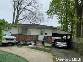 view of front of property with a carport