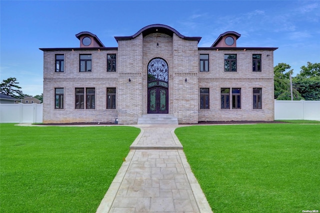 french country inspired facade featuring french doors and a front lawn