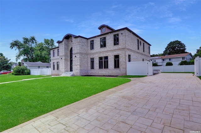 french country style house featuring a front yard