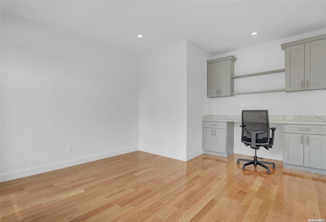 unfurnished office with light wood-type flooring