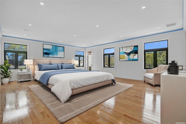 bedroom featuring multiple windows and french doors