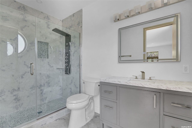 bathroom with vanity, an enclosed shower, and toilet