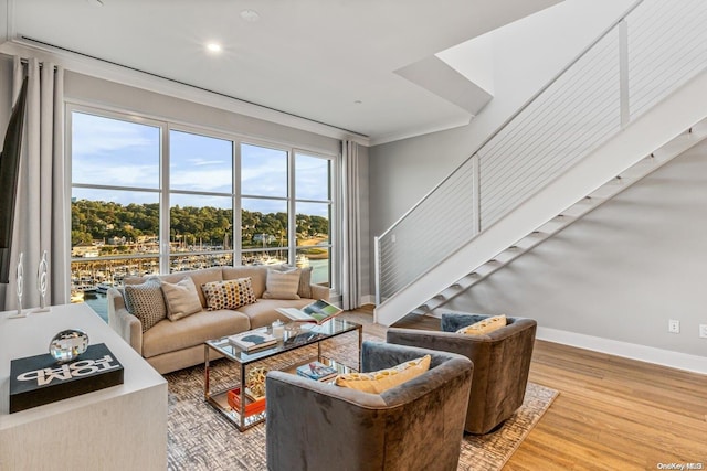 living room featuring crown molding and wood-type flooring