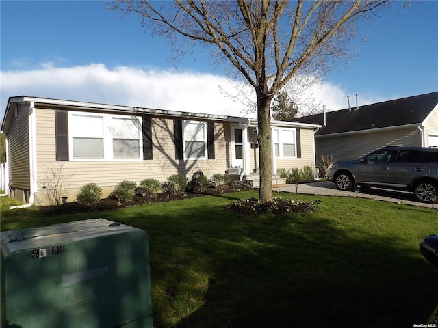 ranch-style house with a front lawn