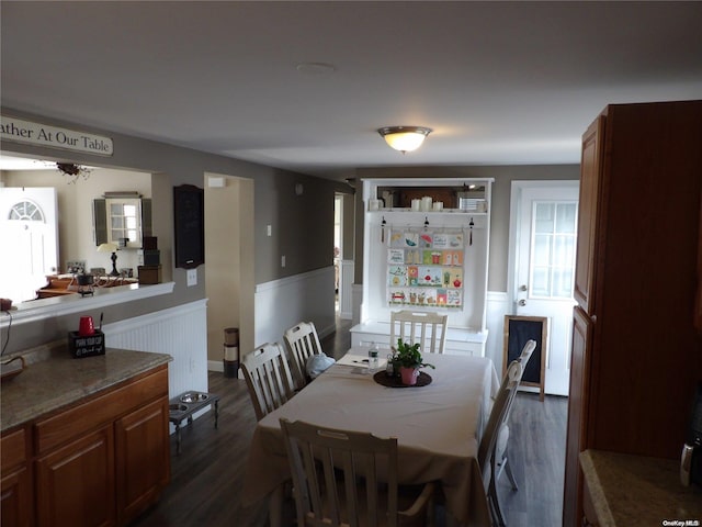 dining area featuring dark wood-type flooring