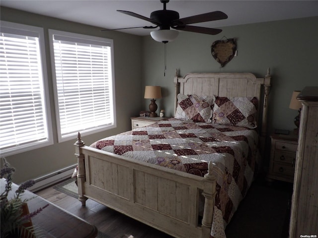 bedroom with hardwood / wood-style flooring, ceiling fan, and a baseboard radiator