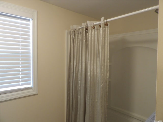 bathroom with a shower with shower curtain