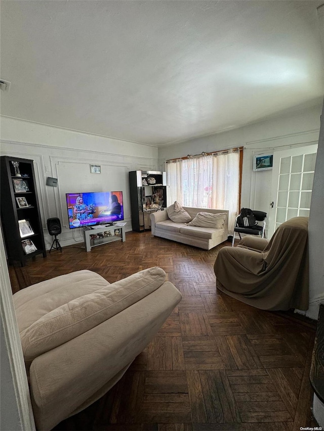 living room featuring dark parquet flooring