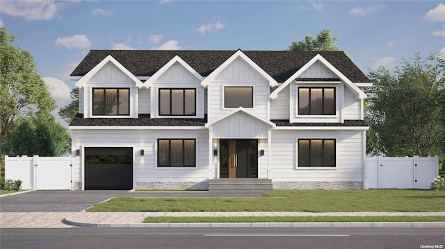 modern farmhouse style home with a front yard and a garage