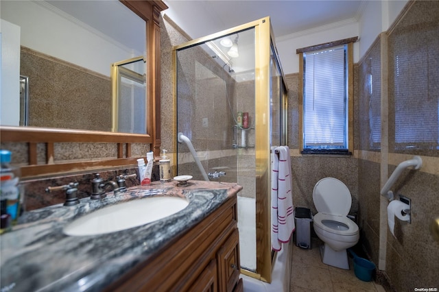 bathroom featuring tile patterned floors, a shower with door, vanity, and ornamental molding