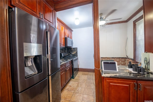 kitchen featuring appliances with stainless steel finishes, backsplash, dark stone counters, and crown molding