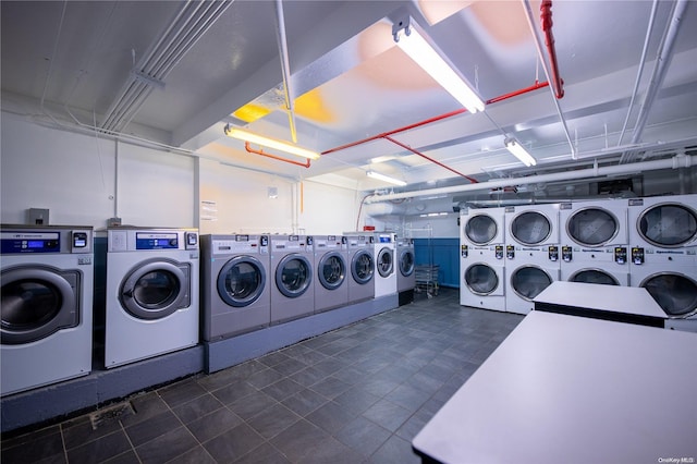 laundry area featuring washer and clothes dryer and stacked washing maching and dryer